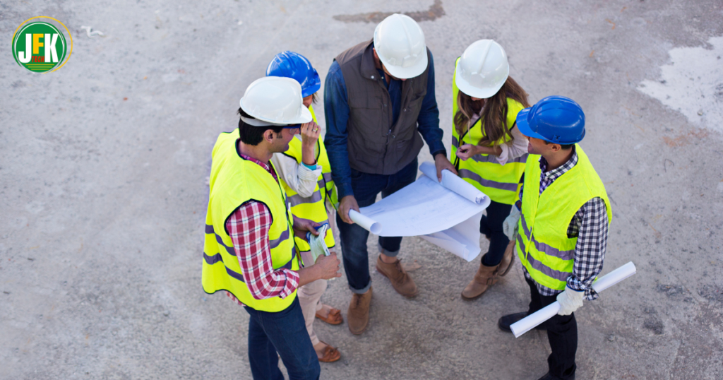 Qualified construction site supervisor leading a construction team after completing SSSTS certification.