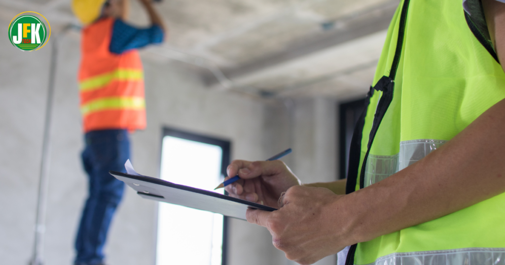 Construction supervisor carrying out a safety inspection on a UK construction site.